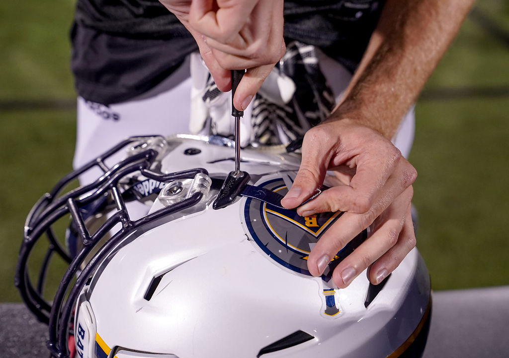 Erich Butler tightens his helmet